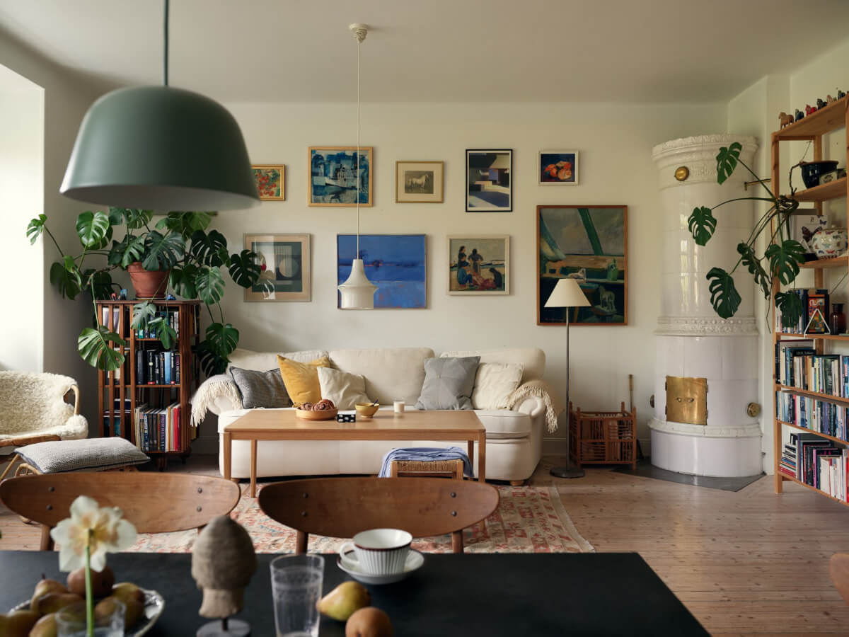 An Art Nouveau Apartment with a Deep Green Kitchen 7 cozy open plan living room fireplace