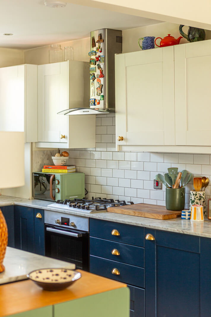 An Open-Plan Living Space and Colorful Bedrooms in a London Duplex 10 dark blue and white kitchen white metro tiles backsplash