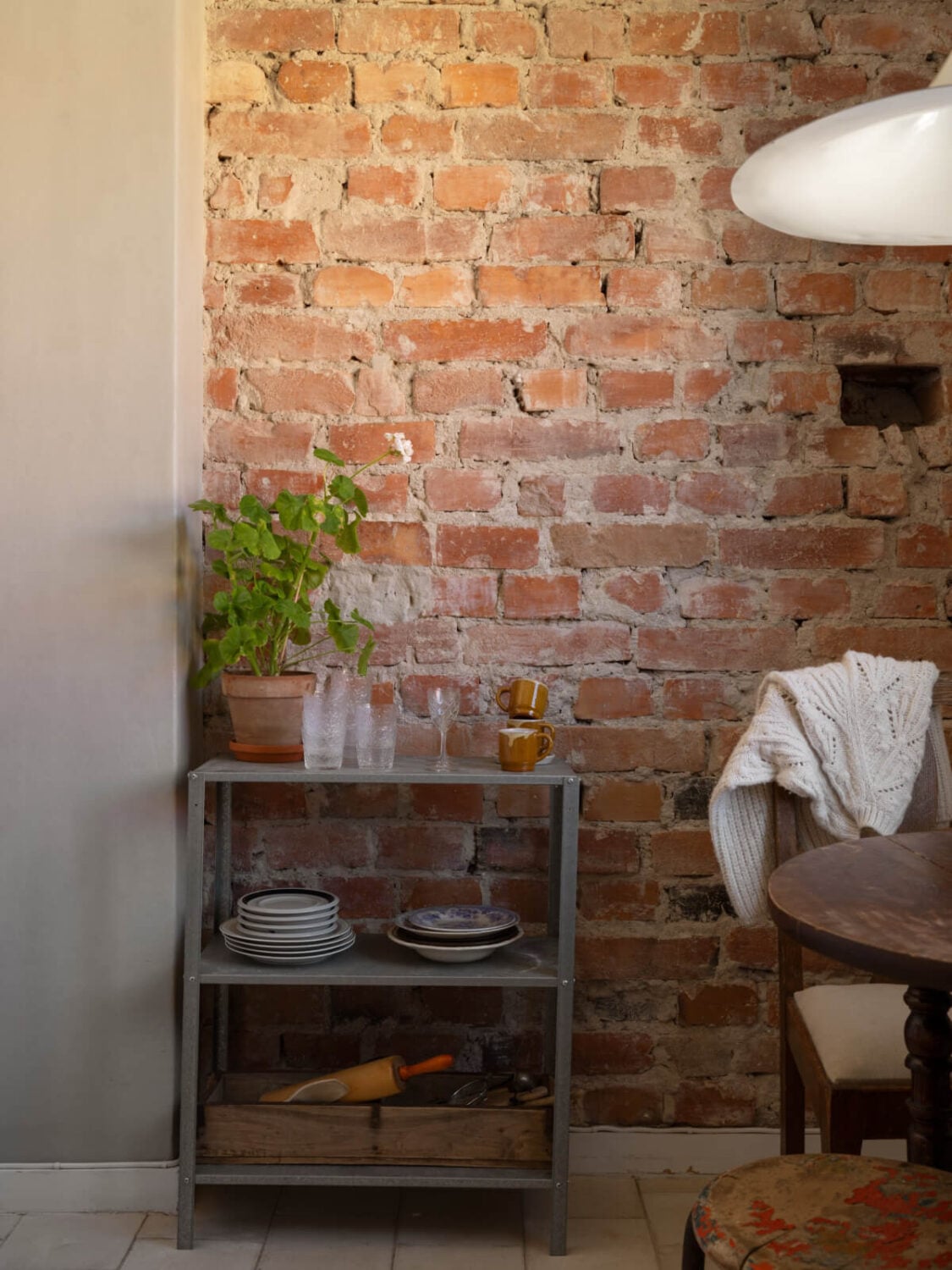 A Small Light-Filled Corner Apartment with Original Details 17 exposed brick wall kitchen