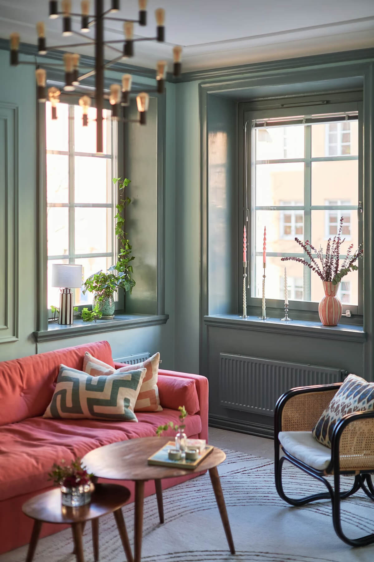 green living room pink sofa