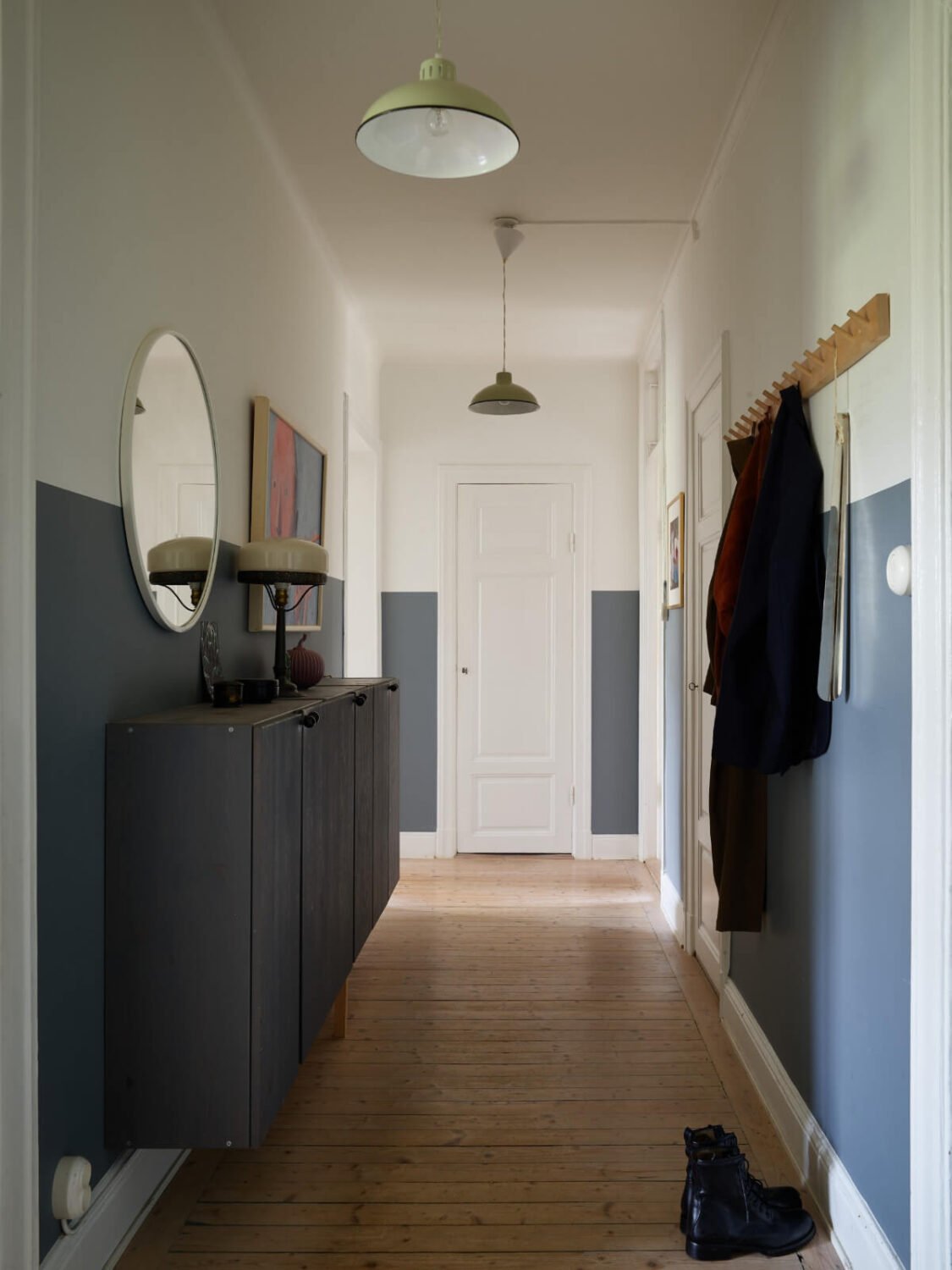 An Art Nouveau Apartment with a Deep Green Kitchen 24 hall half painted wall floating storage cabinets An Art Nouveau Apartment with a Deep Green Kitchen