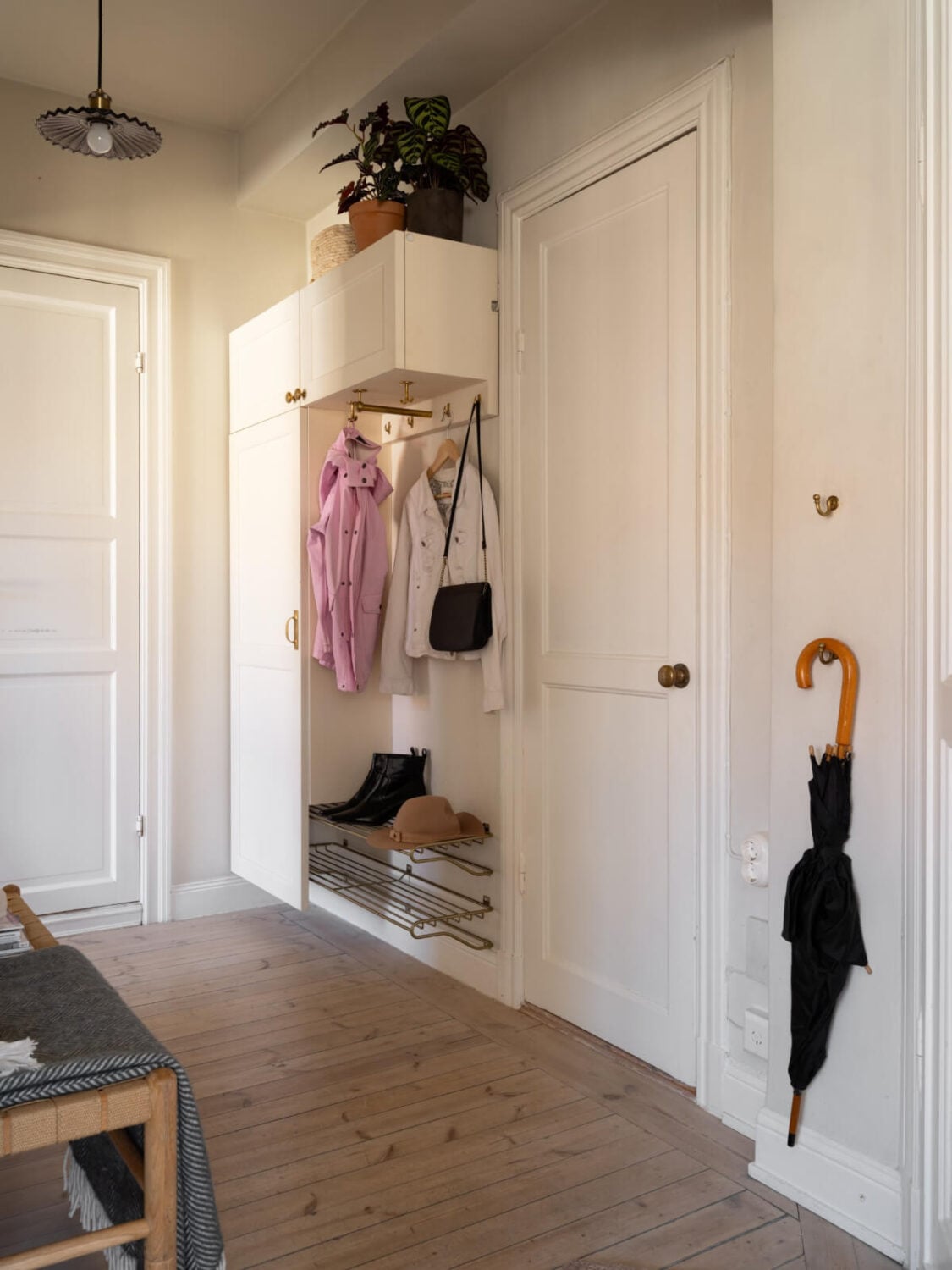 A Small Light-Filled Corner Apartment with Original Details 21 hall with floating cabinets A Small Light-Filled Corner Apartment with Original Details