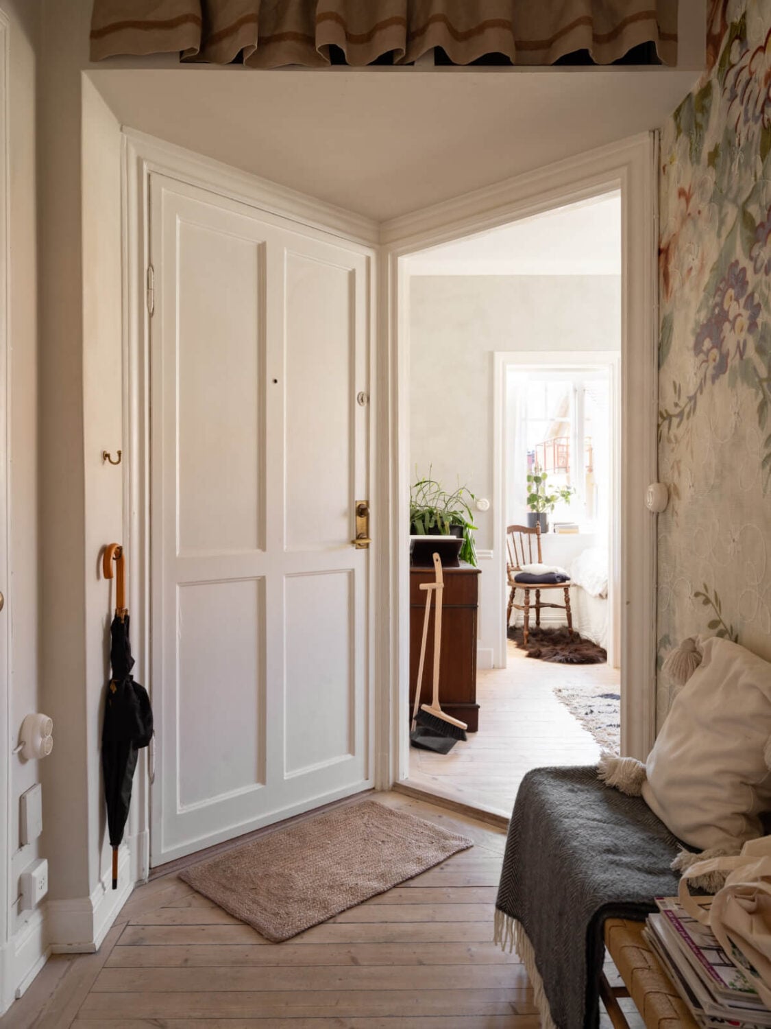 A Small Light-Filled Corner Apartment with Original Details 22 hall with wallpaper wooden floor