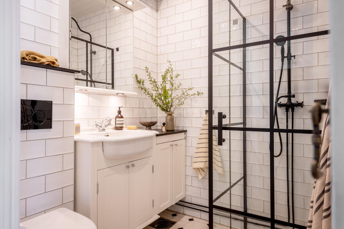 A Cozy Swedish Apartment with a Walk-In Pantry in the Sage Green Kitchen 24 industrial style bathroom