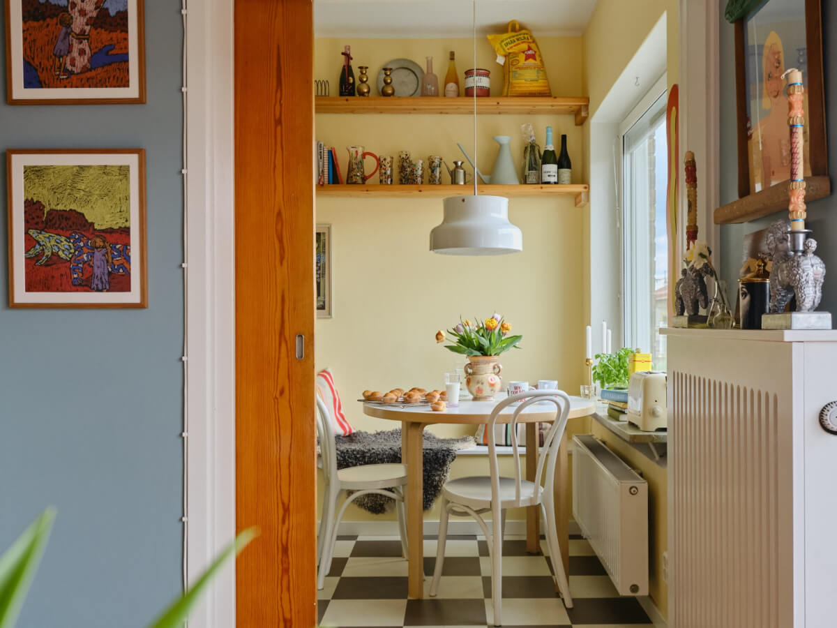 kitchen dining nook round table yellow walls