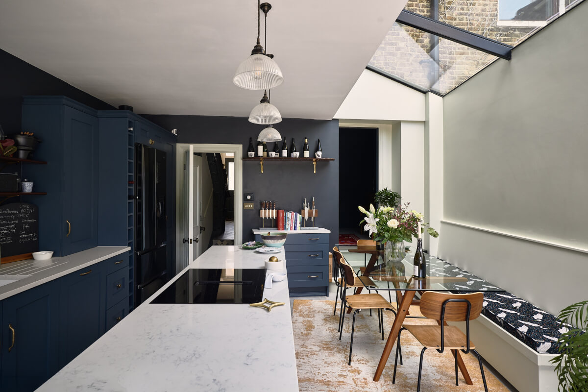 kitchen extension dark blue cabinets skylight glass dining table