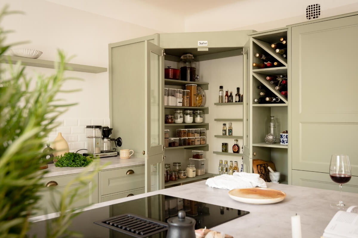 A Cozy Swedish Apartment with a Walk-In Pantry in the Sage Green Kitchen 12 kitchen pantry