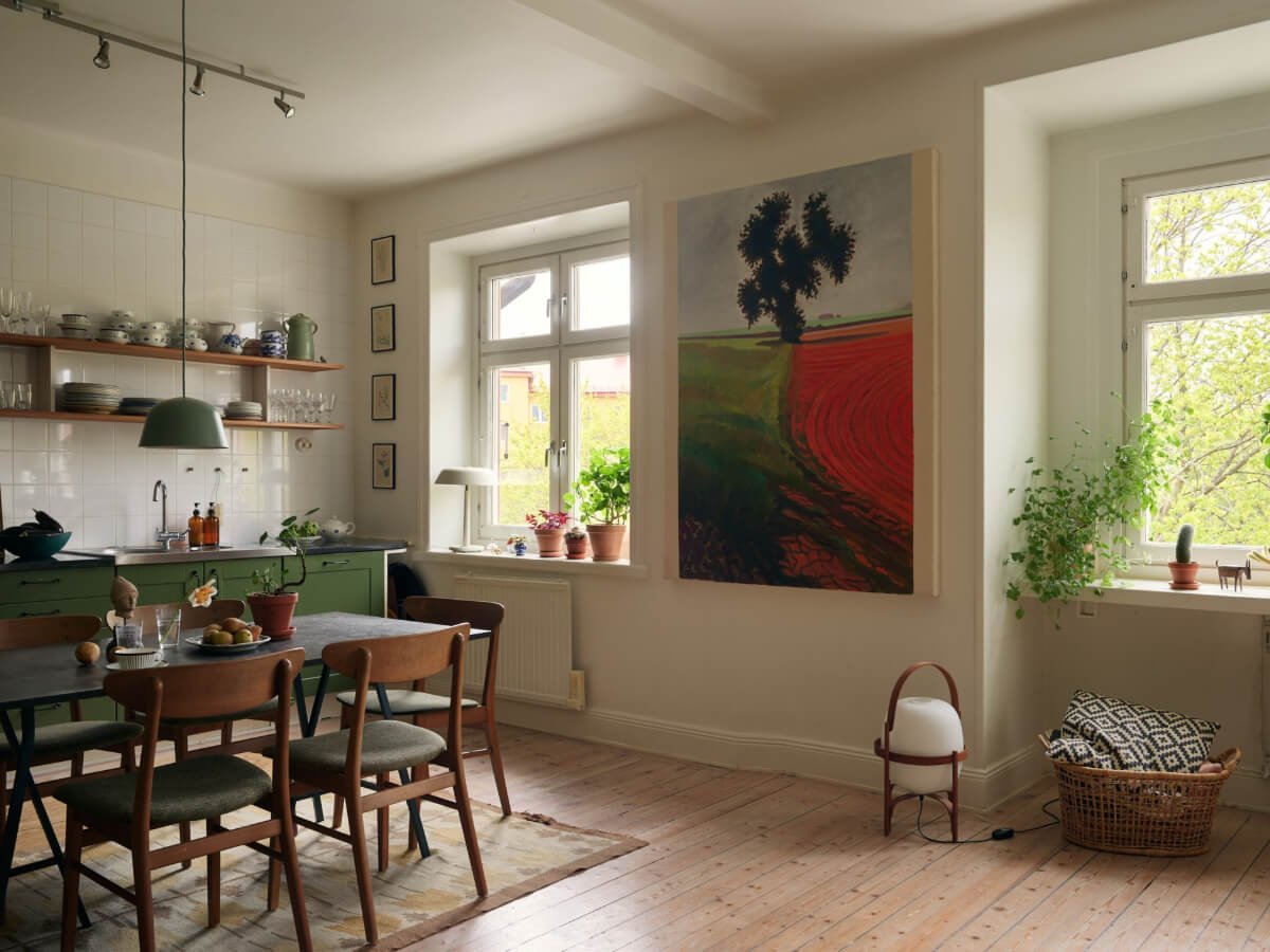 An Art Nouveau Apartment with a Deep Green Kitchen 6 large art open plan living space