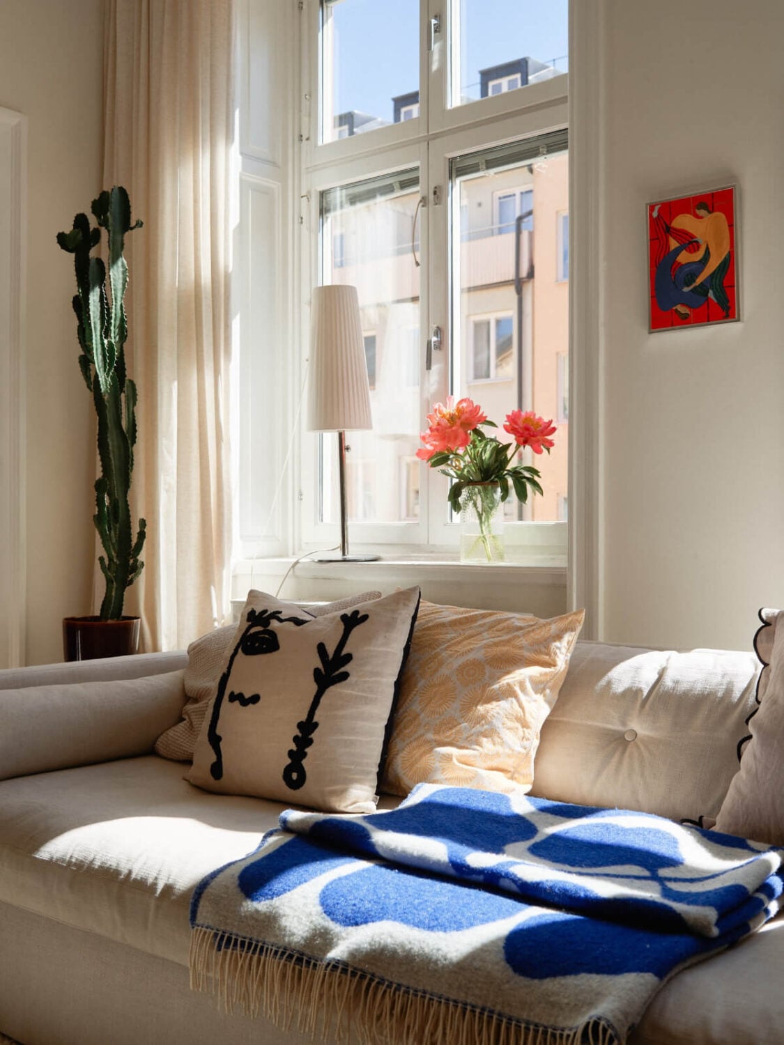 A Light-Filled Stockholm Apartment with Bright Color Pops 5 living room detail