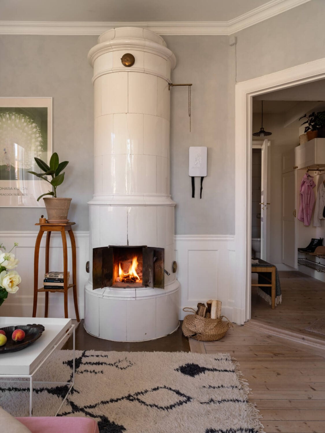 A Small Light-Filled Corner Apartment with Original Details 6 living room kakelugn