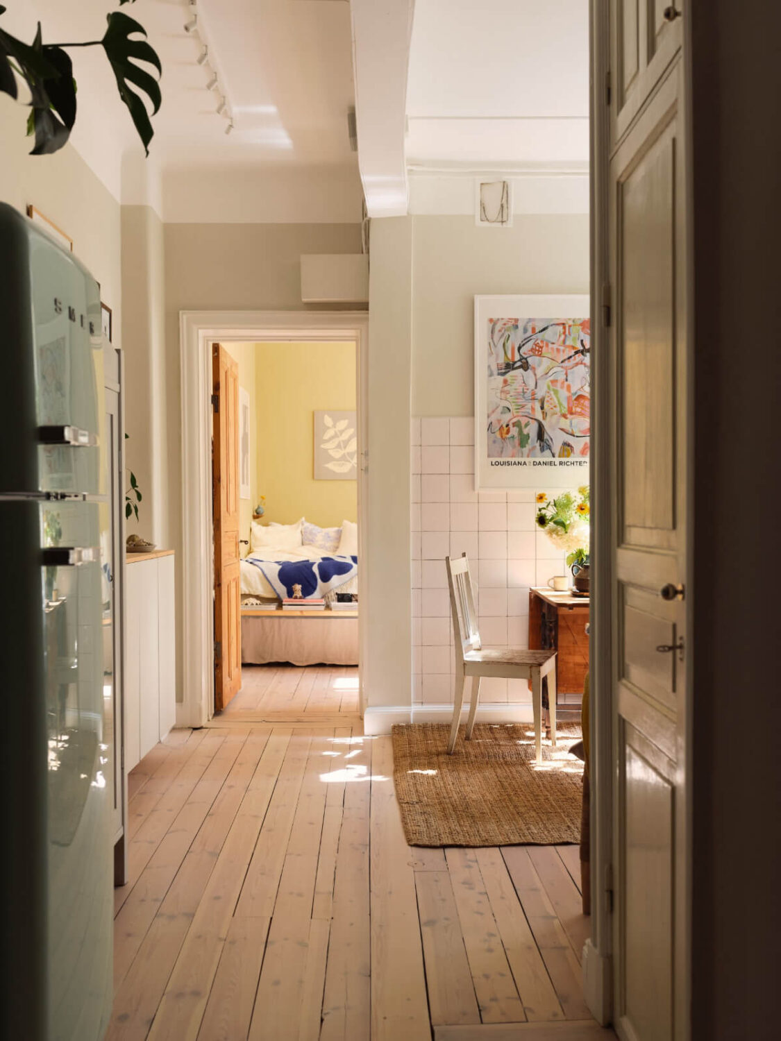 open plan kitchen living and dining space wooden floorboards
