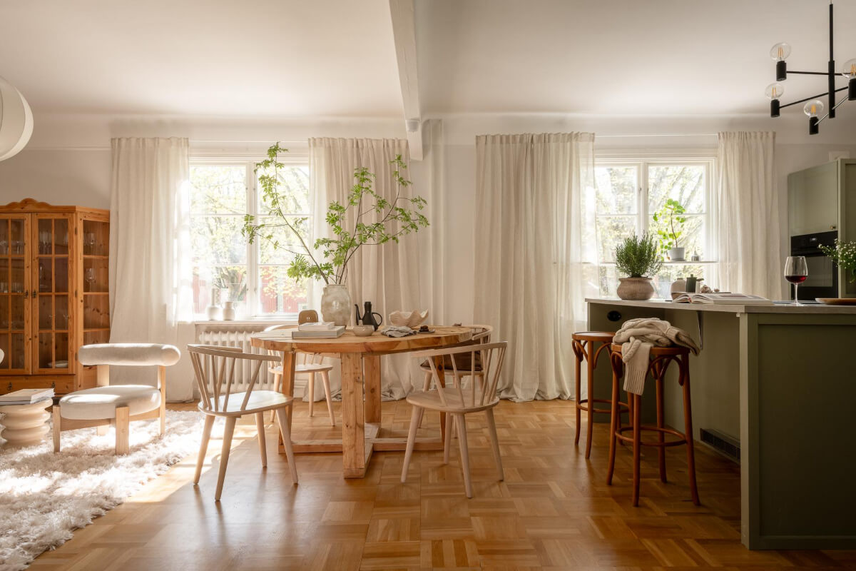 open plan living room green kitchen parquet floor