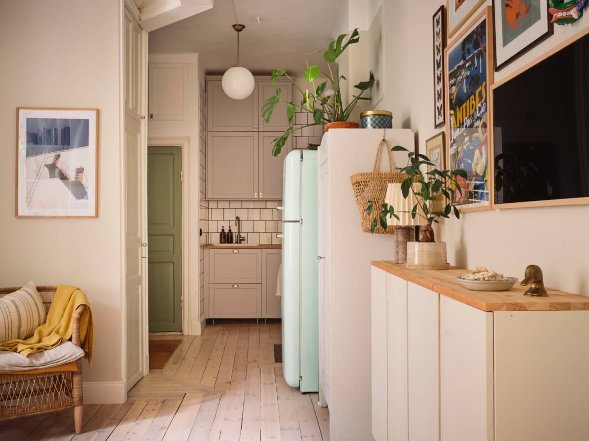 open plan living room kitchen light wooden floorboards