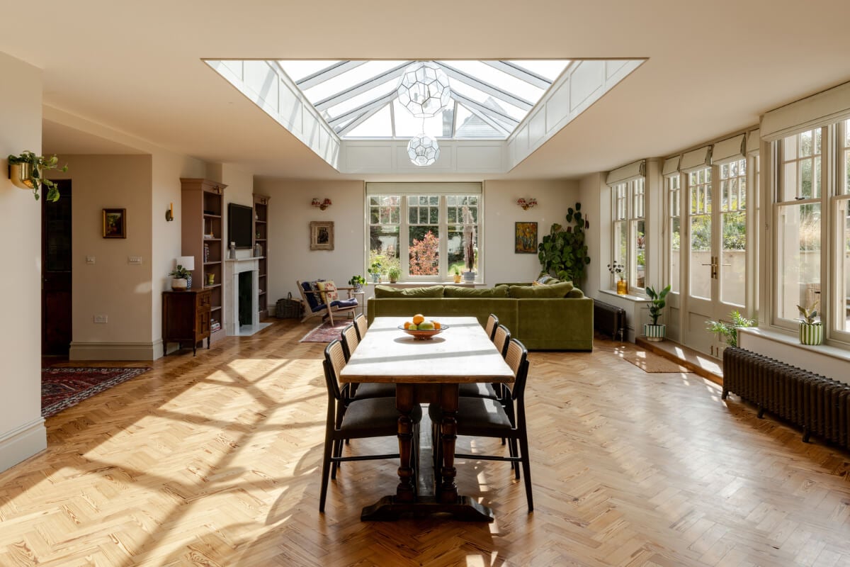 A Grand Edwardian Villa with a Yellow Kitchen and Coastal Views 2 open plan living space huge skylight herringbone floor