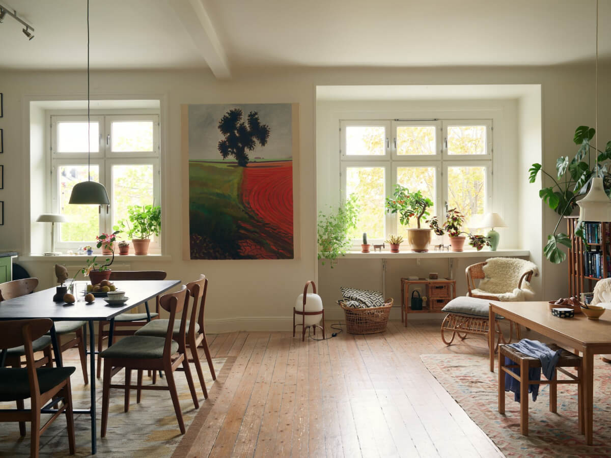An Art Nouveau Apartment with a Deep Green Kitchen 8 open plan living space large windows wooden floor
