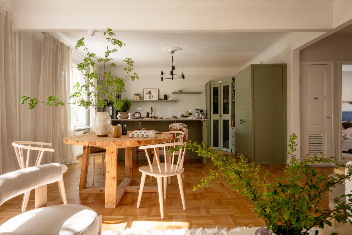 A Cozy Swedish Apartment with a Walk-In Pantry in the Sage Green Kitchen 8 open plan living space rustic table