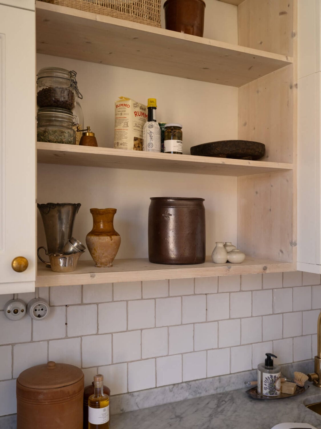A Small Light-Filled Corner Apartment with Original Details 15 open wooden cabinets