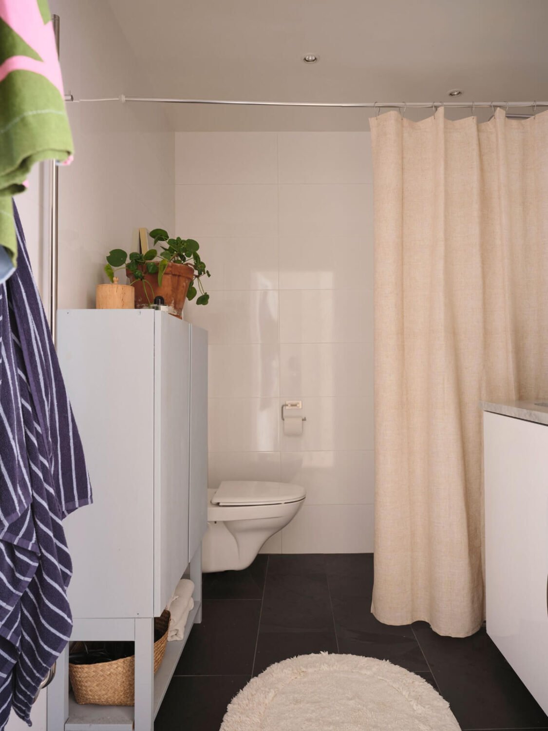 A Light Ground Floor Apartment with a Large Terrace 21 pastel blue cabinet in bathroom