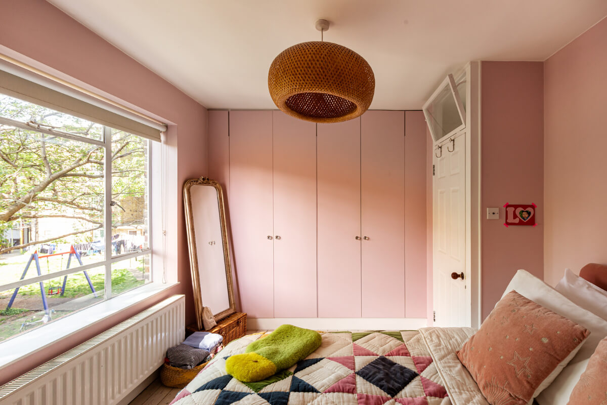 An Open-Plan Living Space and Colorful Bedrooms in a London Duplex 16 pink bedroom built-in wardrobes