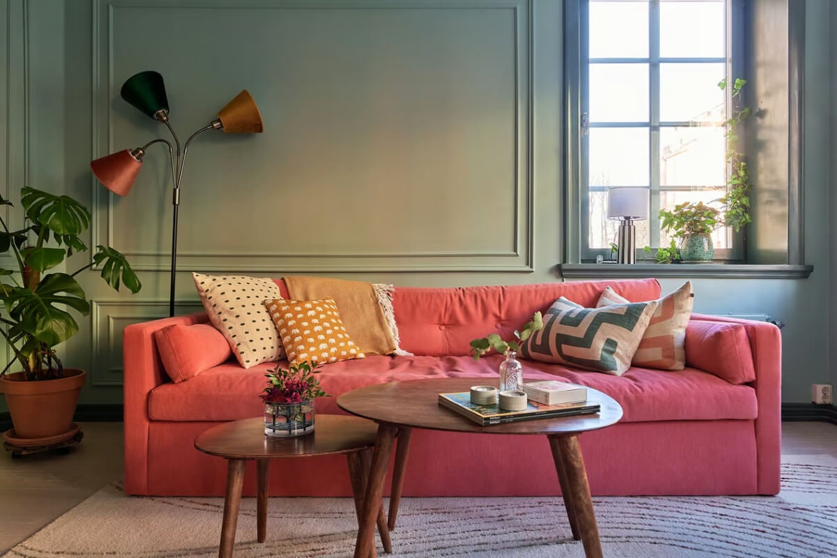 A Green Swedish Corner Apartment with an Open Floor Plan 5 pink sofa