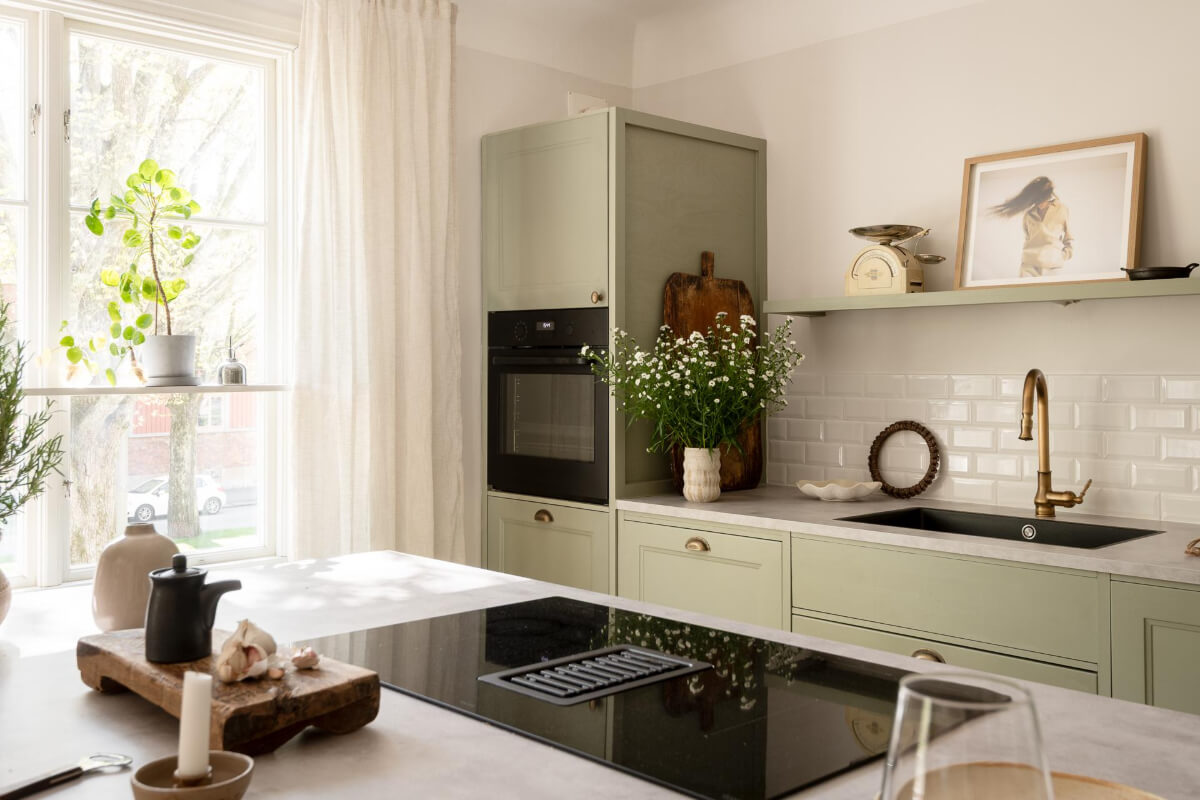 A Cozy Swedish Apartment with a Walk-In Pantry in the Sage Green Kitchen 13 sage green kitchen brass fittings