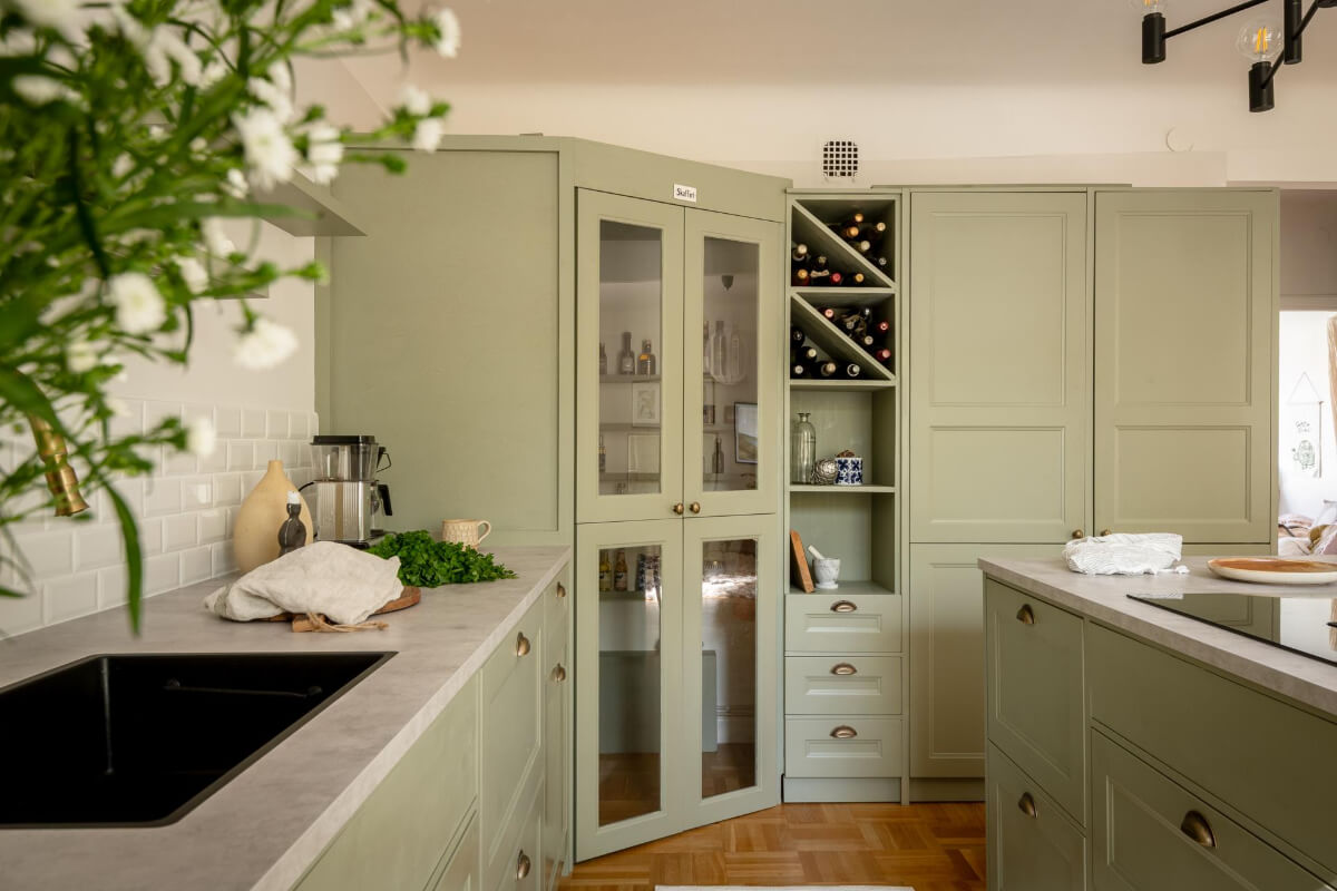 A Cozy Swedish Apartment with a Walk-In Pantry in the Sage Green Kitchen 16 sage green kitchen with corner pantry