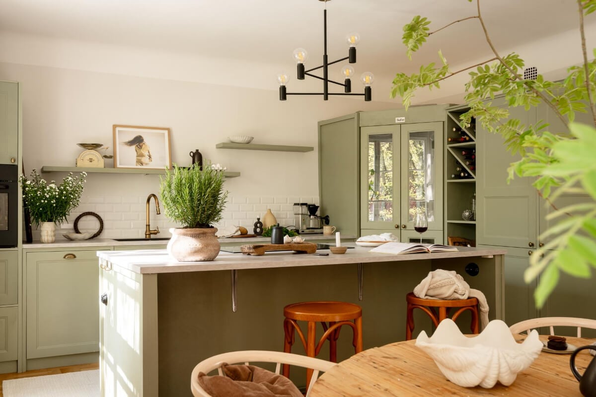 A Cozy Swedish Apartment with a Walk-In Pantry in the Sage Green Kitchen 10 sage green kitchen with island and pantry