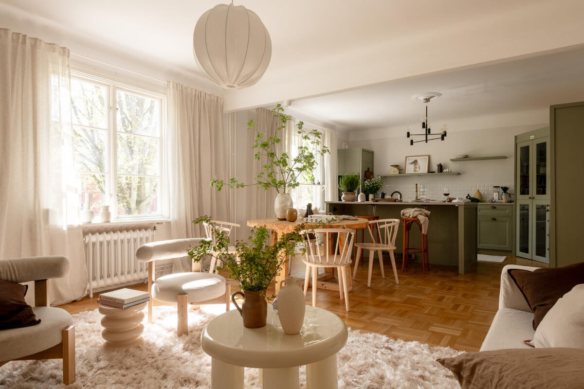 A Cozy Swedish Apartment with a Walk-In Pantry in the Sage Green Kitchen 5 scandi living room round table sage green kitchen