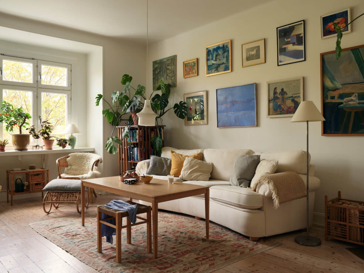 An Art Nouveau Apartment with a Deep Green Kitchen 10 sitting room gallery wall