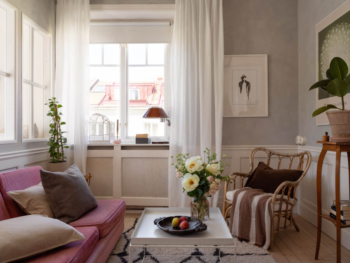 A Small Light-Filled Corner Apartment with Original Details 2 small living room pink sofa