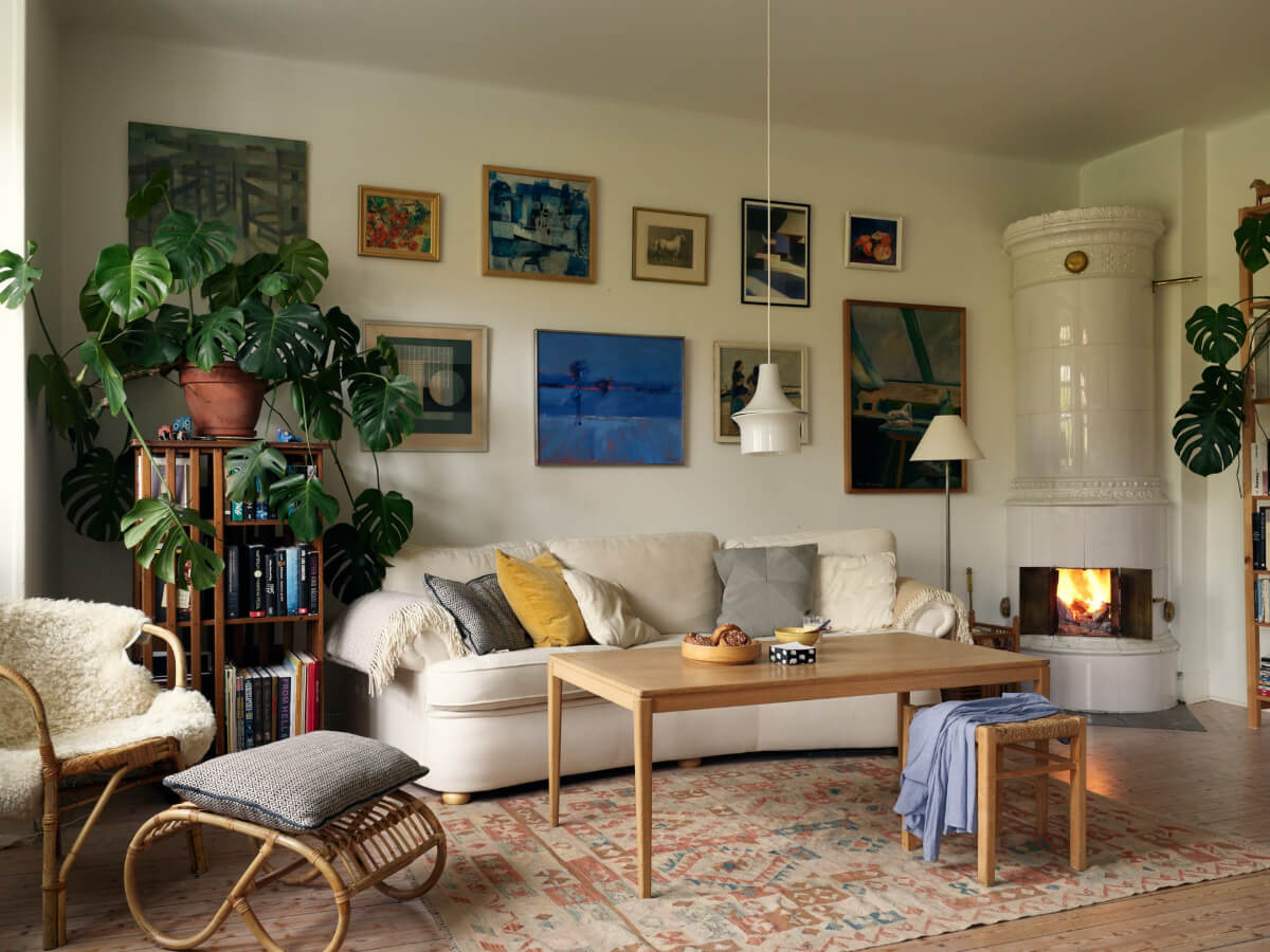 An Art Nouveau Apartment with a Deep Green Kitchen 12 swedish sitting room plants fireplace