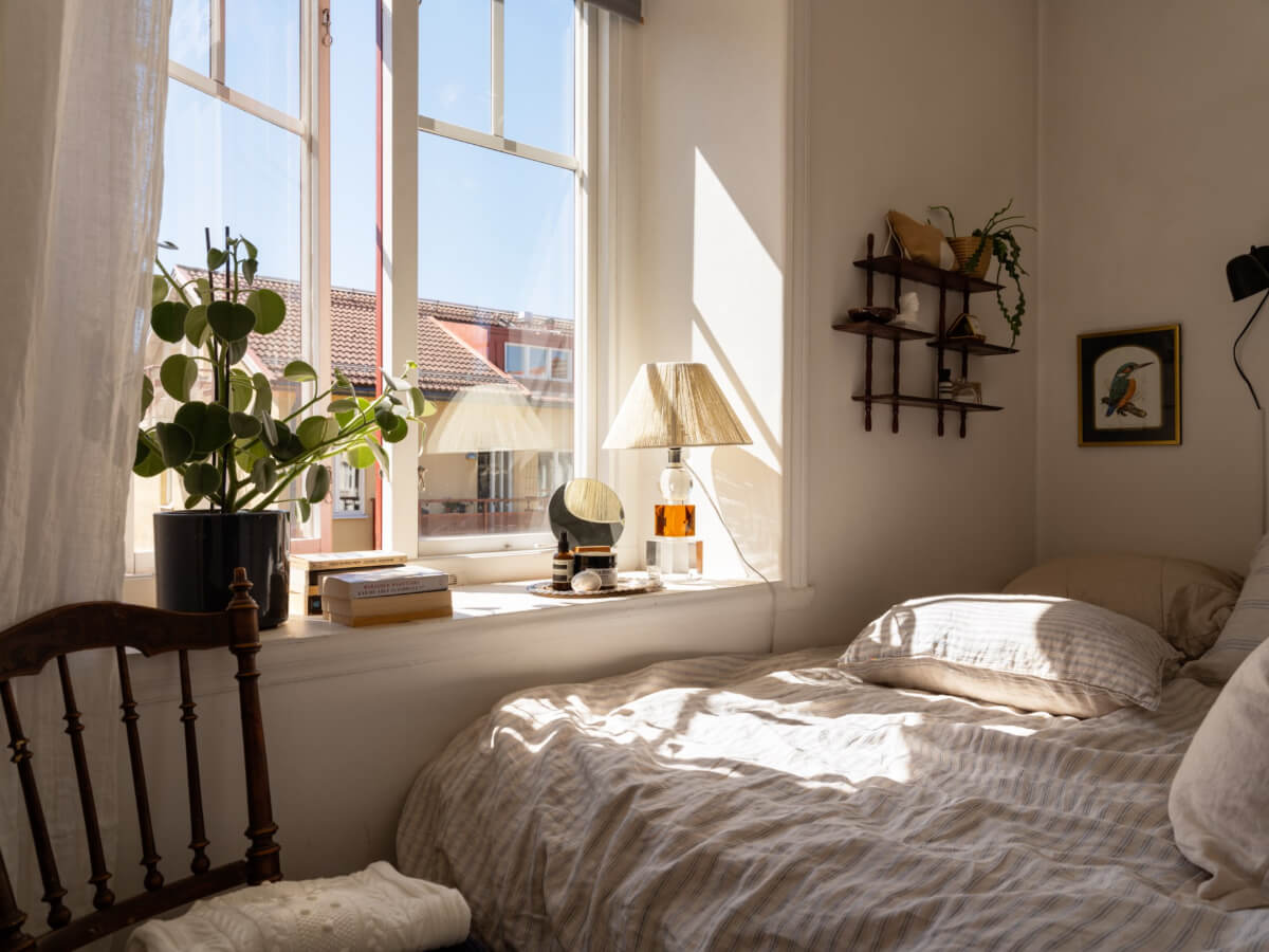A Small Light-Filled Corner Apartment with Original Details 9 tiny bedroom large window deep window sill