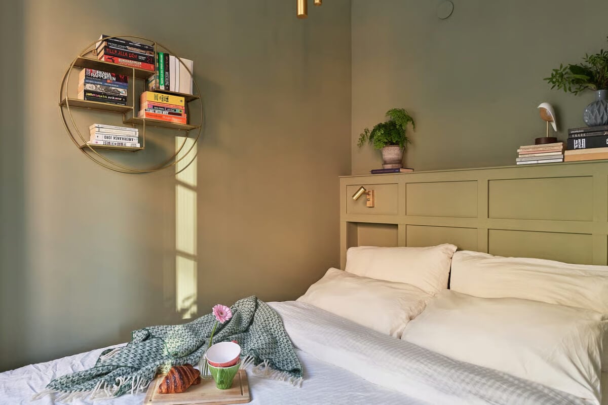 A Green Swedish Corner Apartment with an Open Floor Plan 16 tiny green bedroom