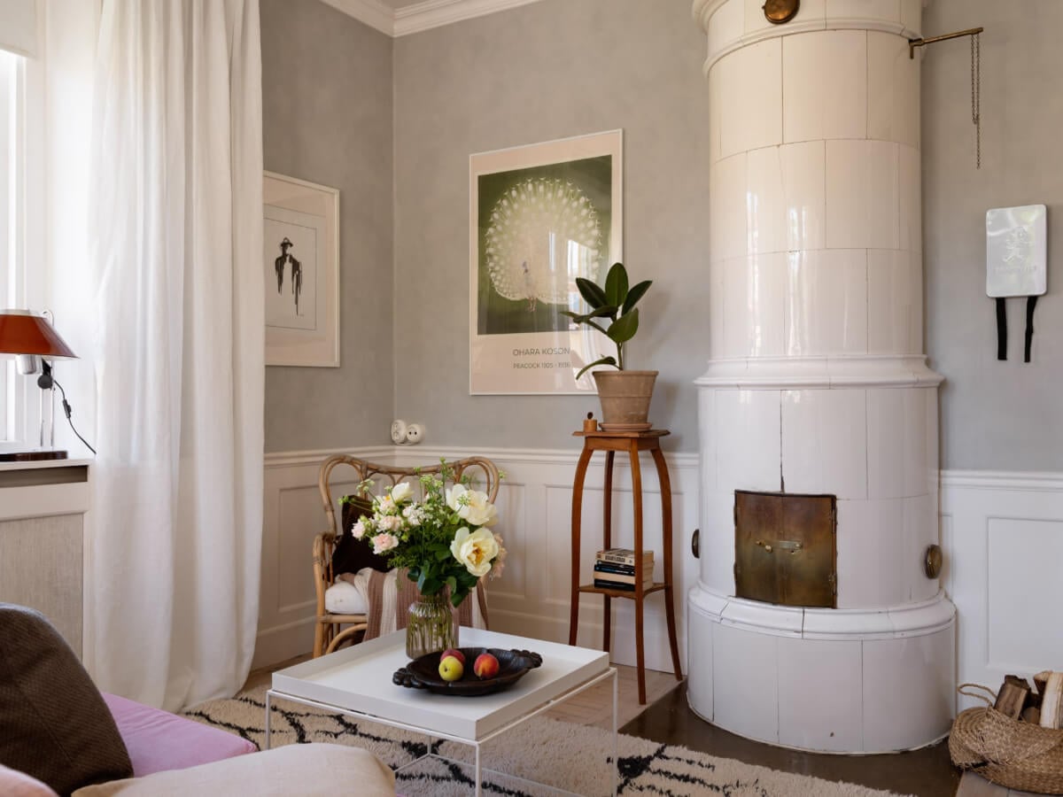 A Small Light-Filled Corner Apartment with Original Details 4 tiny living room white fireplace