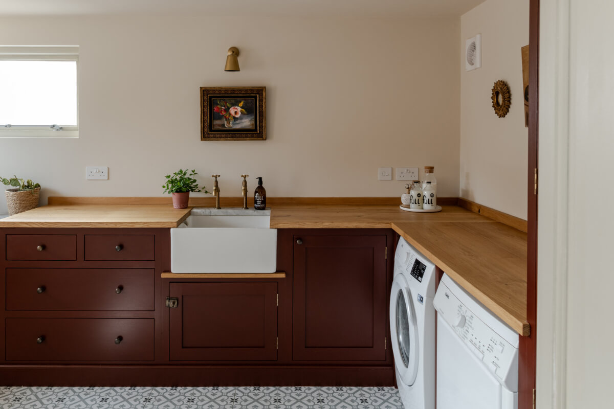 PPG & Glidden Color of the Year 2026: Warm Mahogany 10 utility room deep red cabinets
