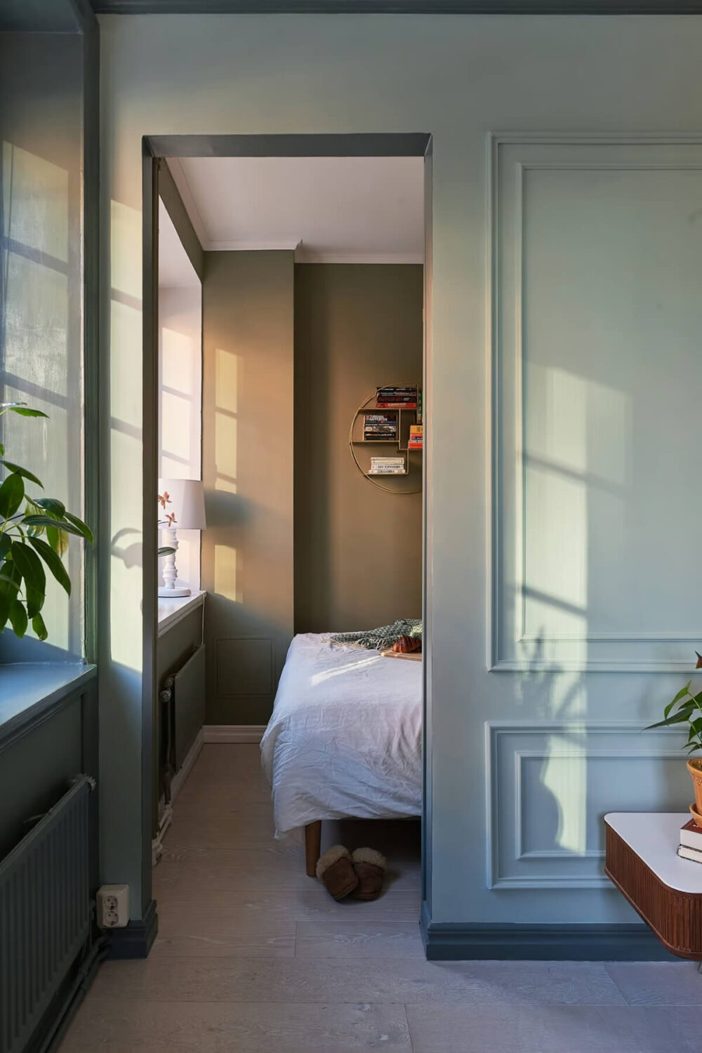 A Green Swedish Corner Apartment with an Open Floor Plan 13 view into small bedroom