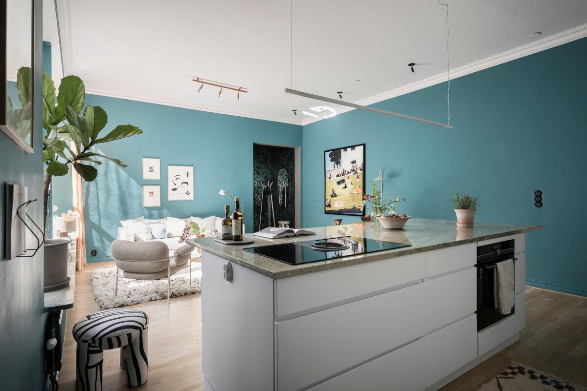 A Teal Green Living Room and Large Windows in a Swedish Apartment 14 view living space from kitchen island