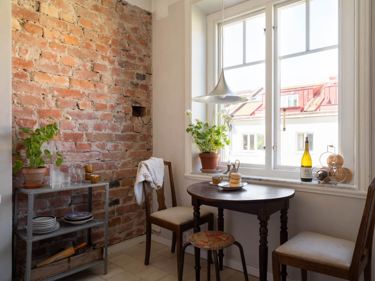 A Small Light-Filled Corner Apartment with Original Details 12 vintage wooden kitchen table