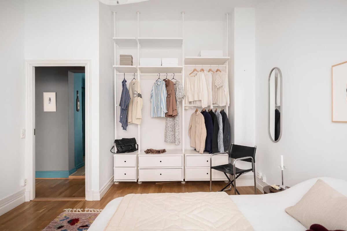 A Teal Green Living Room and Large Windows in a Swedish Apartment 19 white bedroom open wardrobes