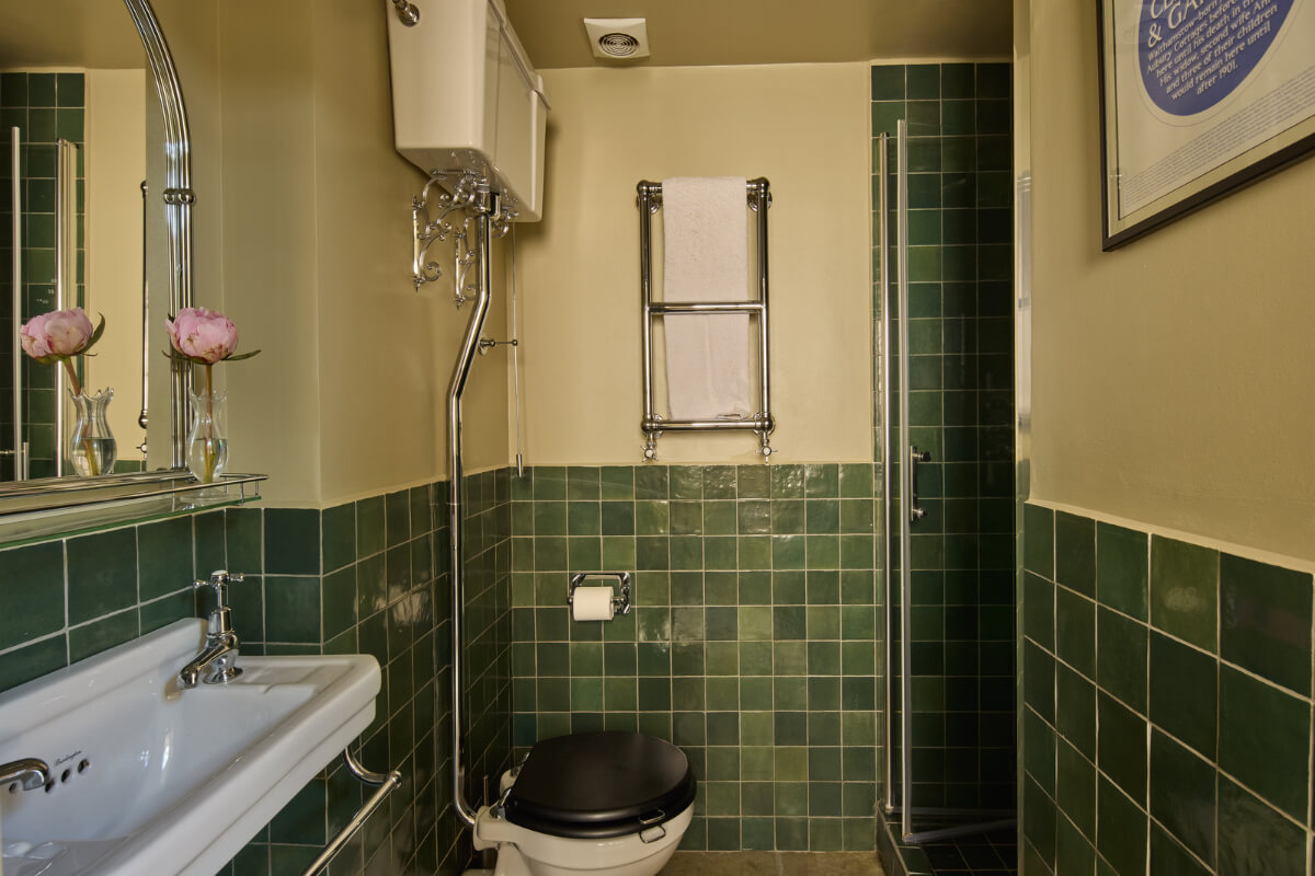bathroom green tiles beige walls