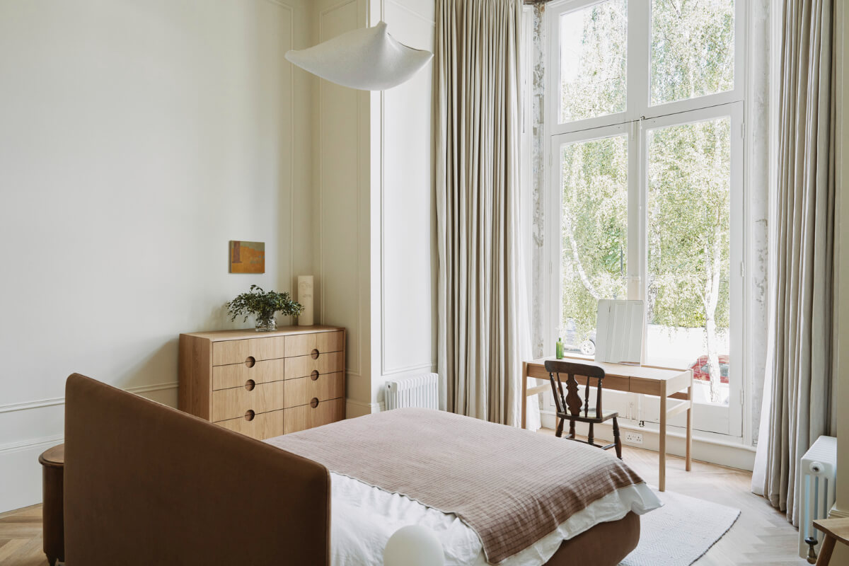 Grand Proportions and Bay Windows in a Belsize Park Apartment 15 bedroom bed in the center of the room desk in front of bay window