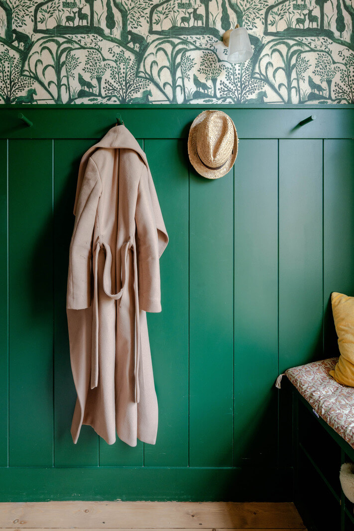 boot room green paneled walls wallpaper