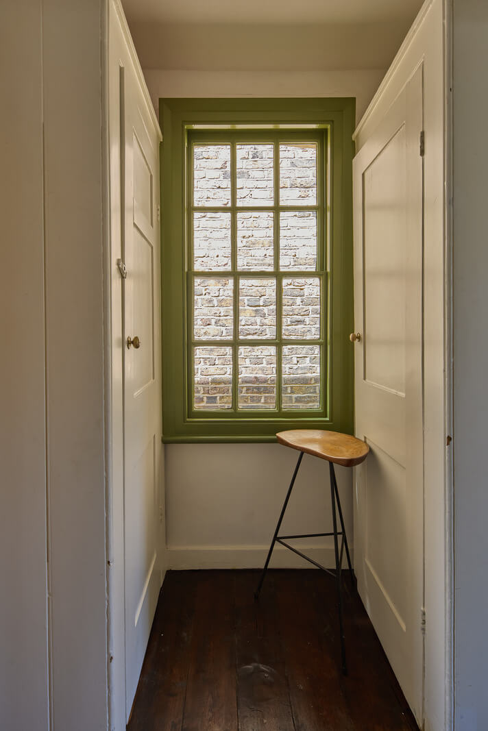built-in wardrobes green windowframe