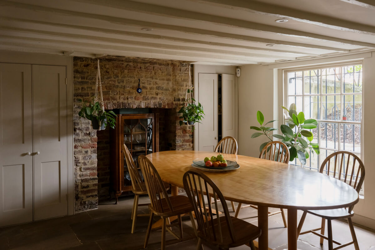 dining room low ceiling brick wall fireplace