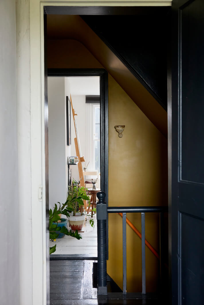 first floor landing black-painted wooden floorboards