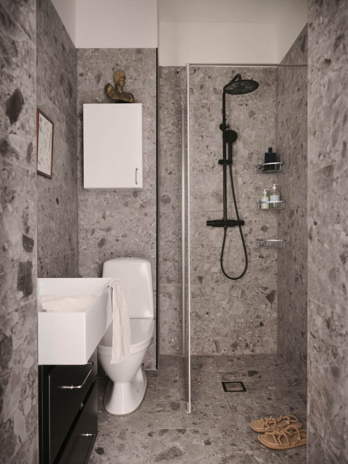 gray tiled bathroom black fittings