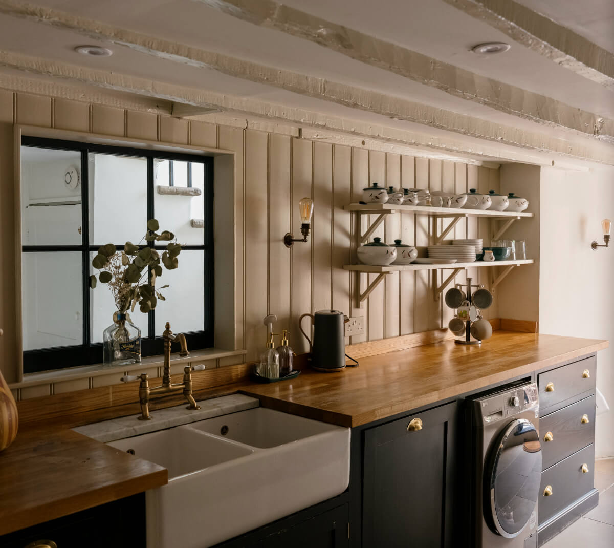 kitchen with butler sink brass fittings