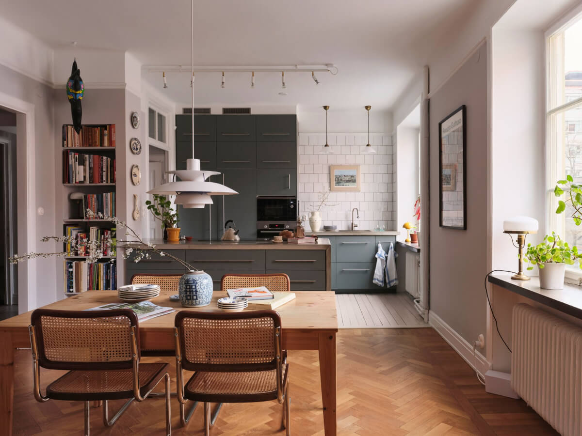 An Early 20th Century Apartment with a Muted Green Kitchen 1 open plan kitchen dining space