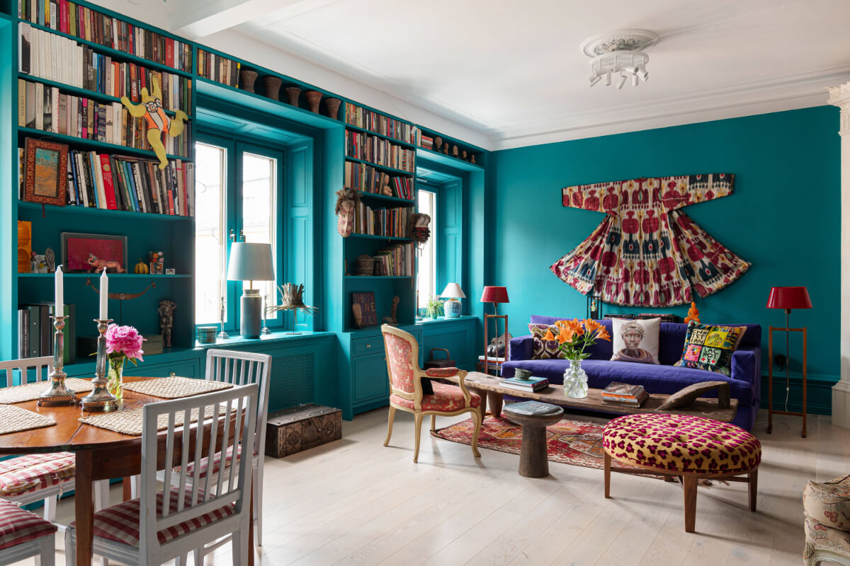 Bold Teal Walls and Antiques in a Turn-of-the-Century Apartment 1 teal living room bookcases around window