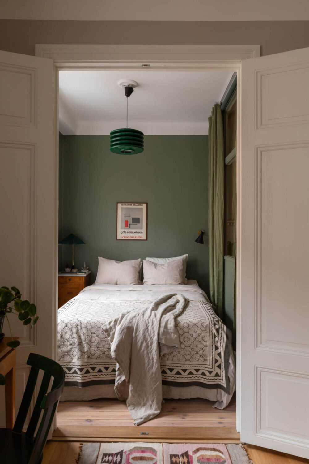 view into small green bedroom